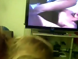 Old woman gives son head while he watches porn